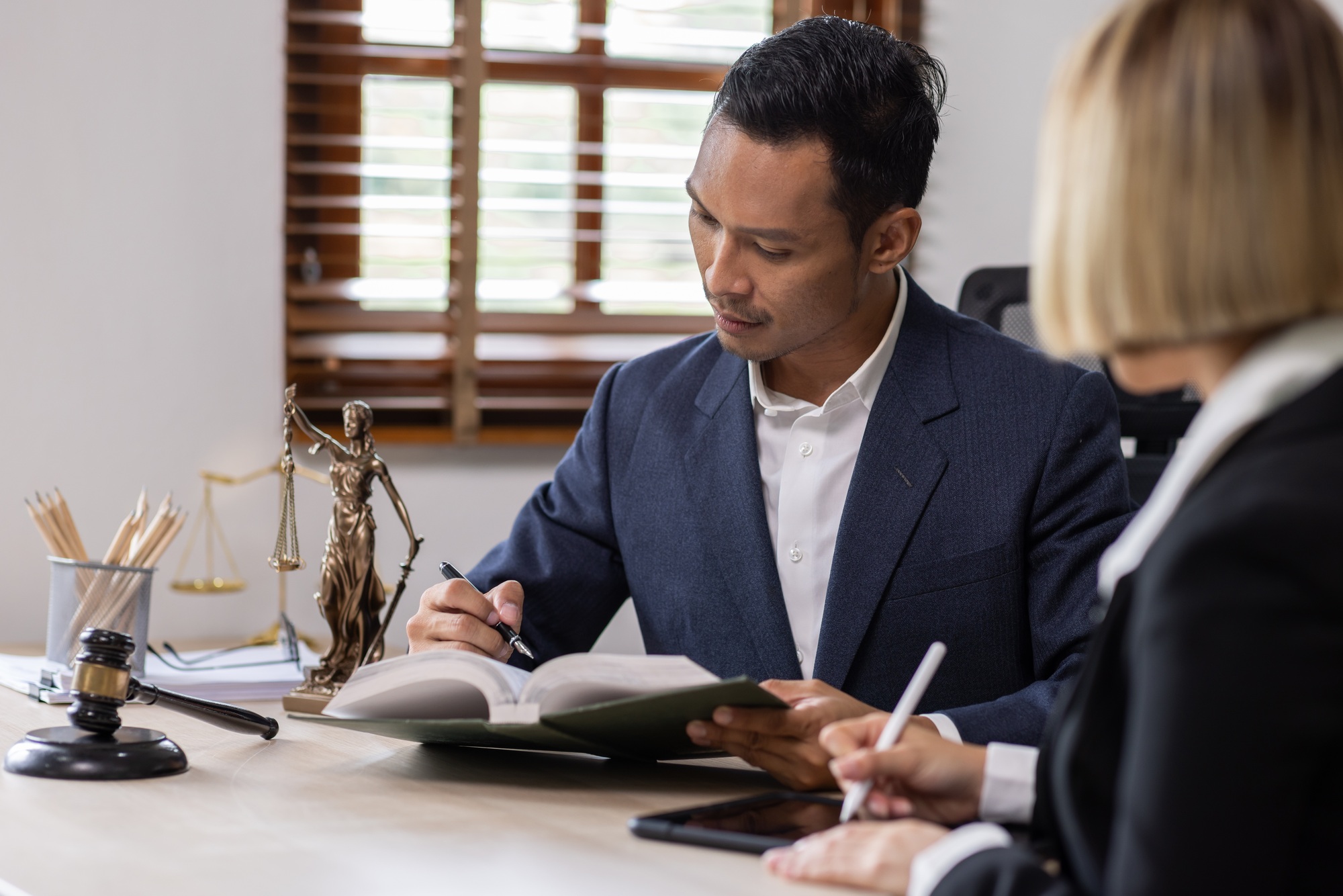 Business Asian people and lawyers, Businessman and lawyer discuss the contract document. Judge gavel