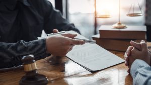 Businessman and lawyer discuss the contract document. Treaty of the law. Sign a contract business.