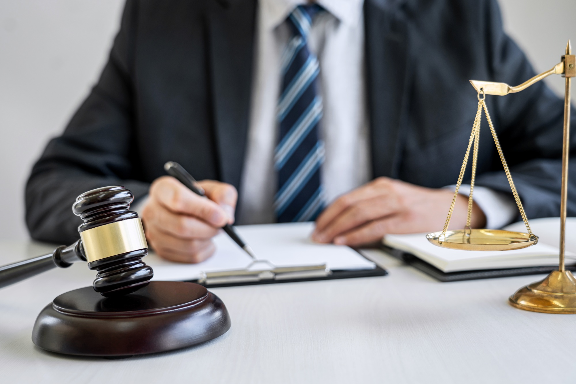 Male lawyer or judge working with contract papers